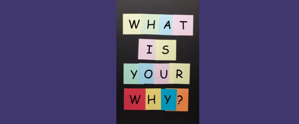 Post it notes lined up saying what is your why on a black and purple background. 