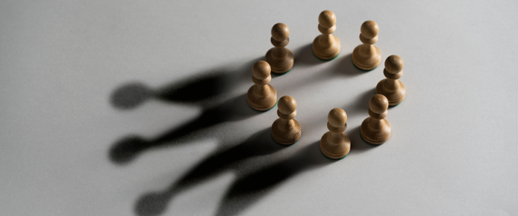 Image of wooden leaders creating culture shadows